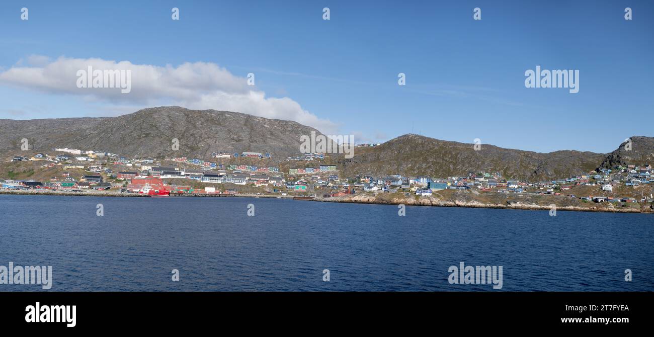 Panoramic Photo Of The Town Of Qaqortoq Greenland Seen From The Sea, Complete Skyline And Colourful Homes And Buildings Stock Photo