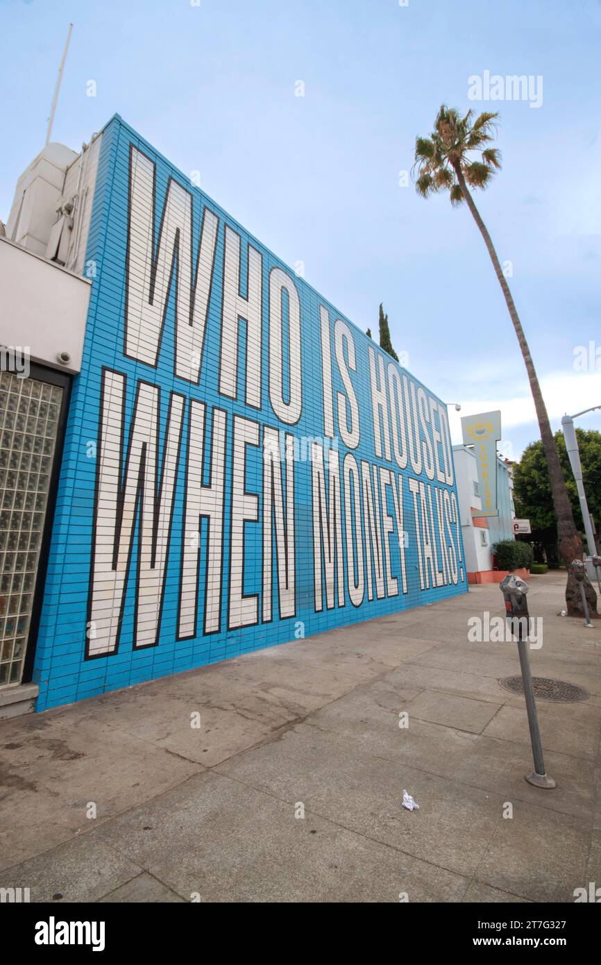 mural by conceptual artist Barbara Kruger painted wall los angeles who is housed when money talks - sunset boulevard housing crisis Stock Photo