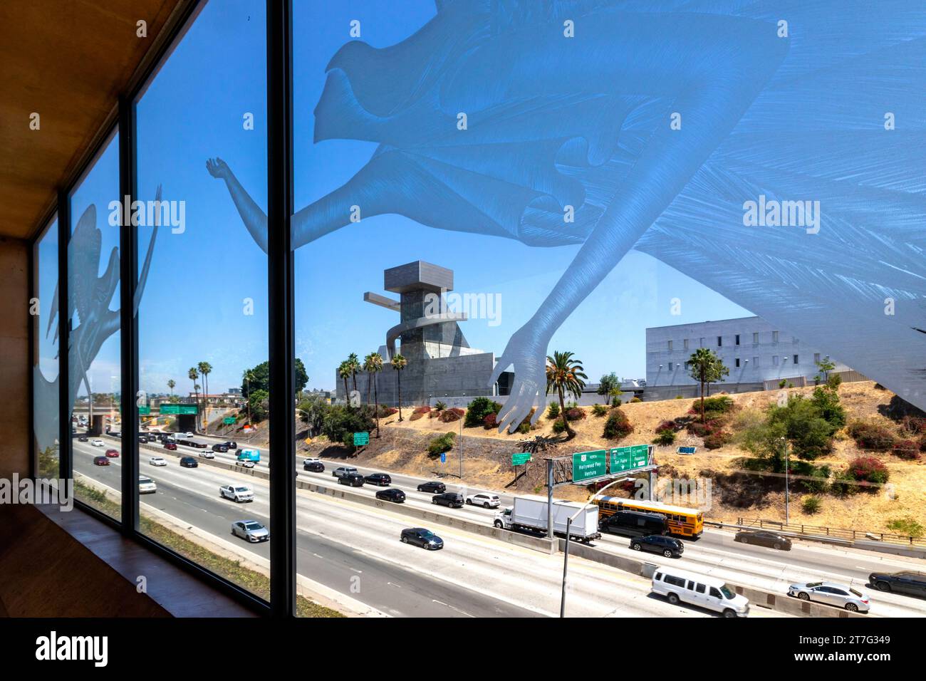 Ramón C.Cortines School Visual & Performing Arts through etched glass Cathedral of Our Lady of the Angels  across the 101, Los Angeles California USA Stock Photo