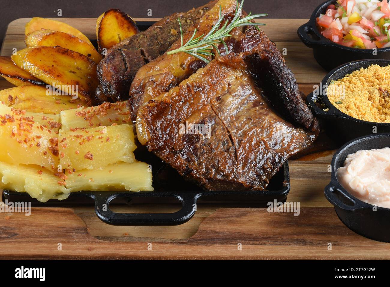 Grilled Chuck Eye Roll Steak roasted on a chopping board. bbq barbecue