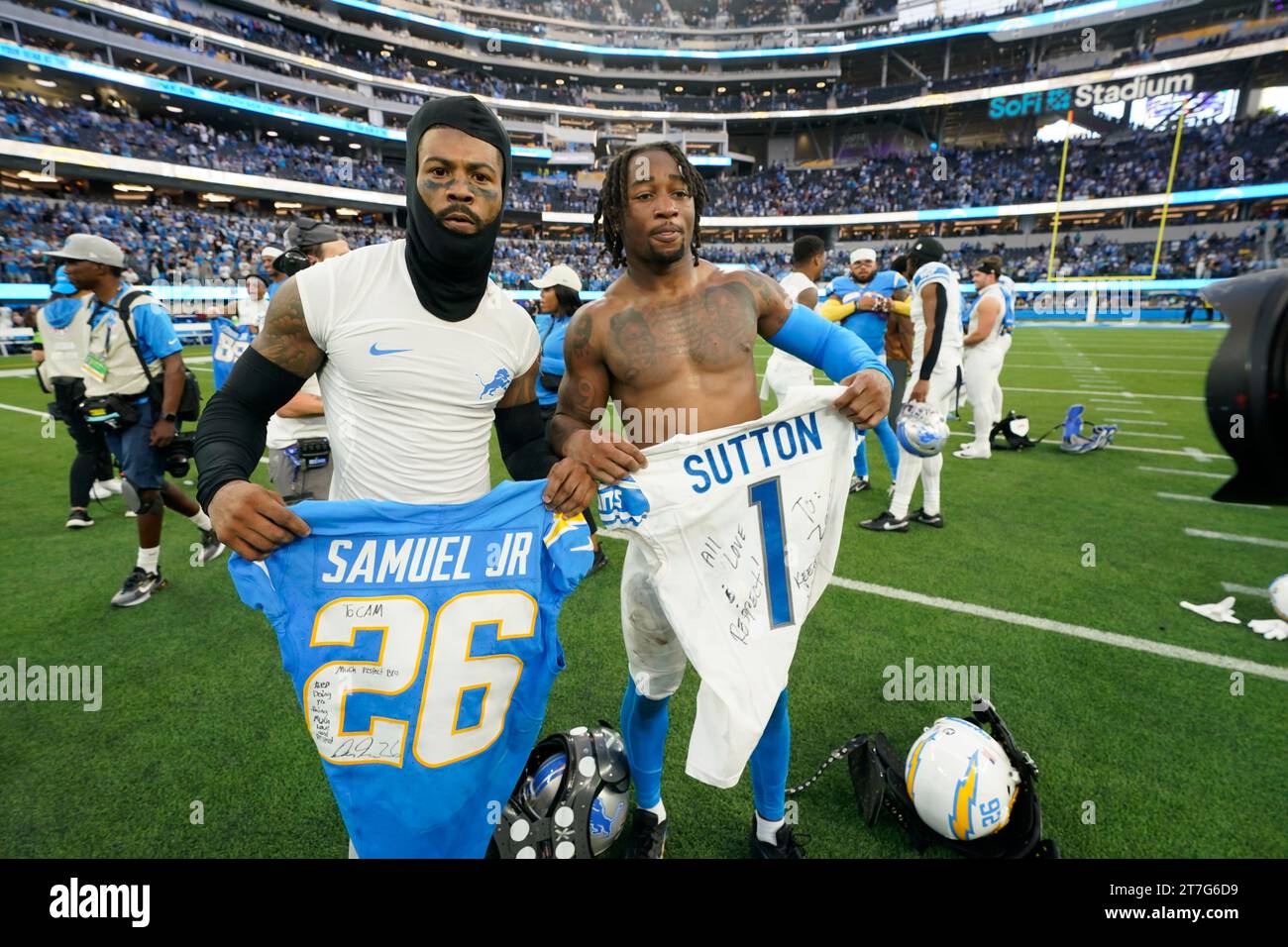 Detroit Lions cornerback Cameron Sutton, left, trades jerseys with Los