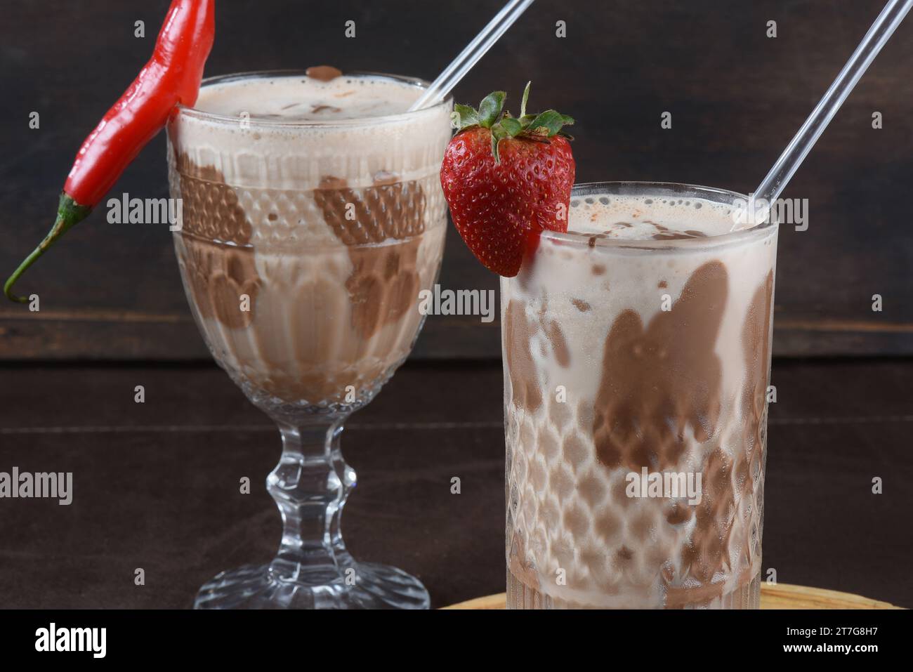 chocolate drink with milk and alcoholic amarula with strawberry Stock