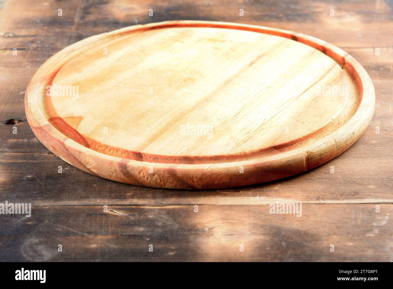 empty round wooden board ideal for placing plates and food montages Stock Photo