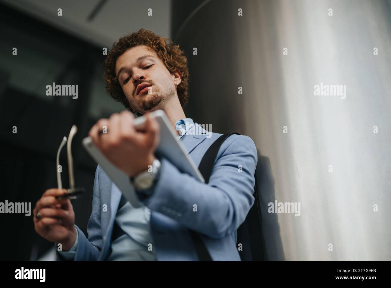 Creative Architects Collaborating on Blueprint for Construction Project Stock Photo