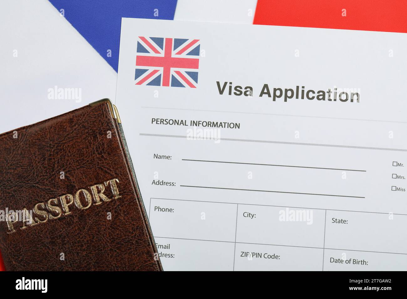 Immigration To United Kingdom Visa Application Form And Passport On Flag Top View Stock Photo immigration-to-united-kingdom-visa-application-form-and-passport-on-flag-top-view-stock-photo