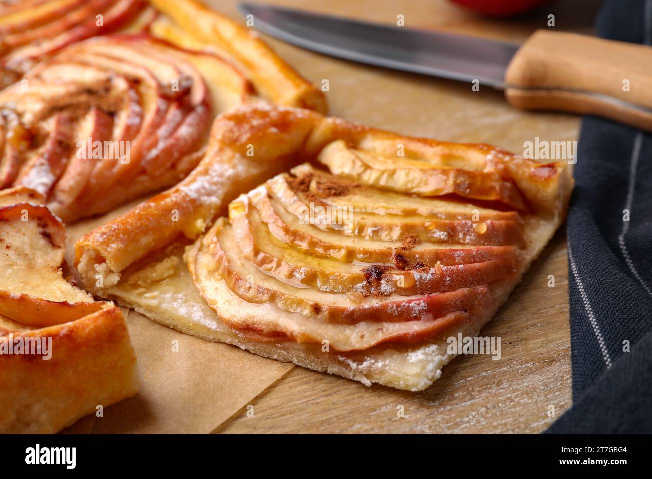Piece of freshly baked apple pie on wooden table, closeup Stock Photo