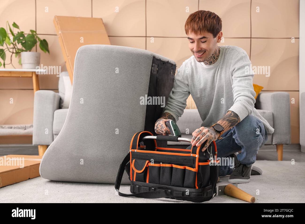 Young man bag tools hi-res stock photography and images - Alamy