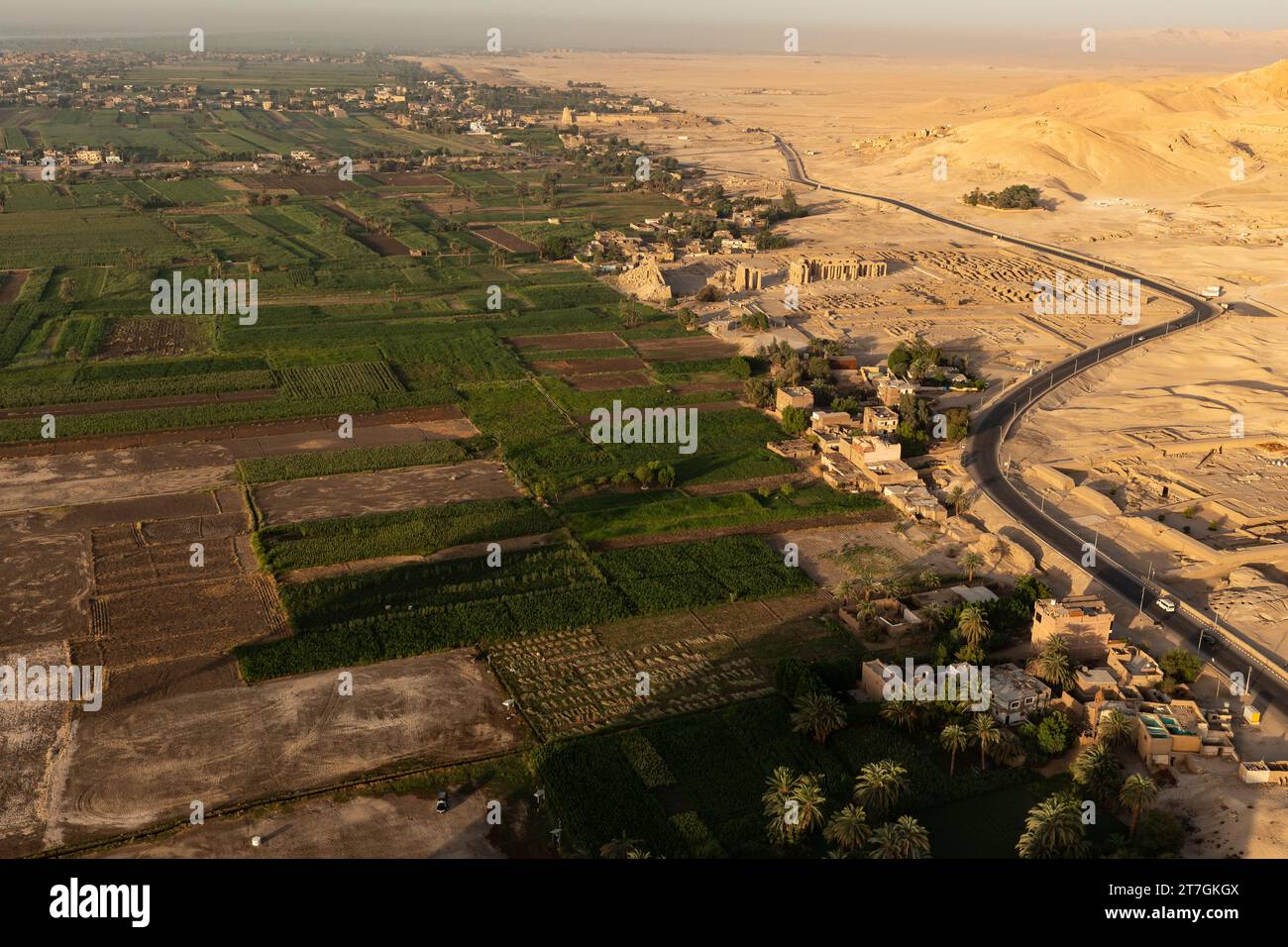 Aerial view of lush irrigated nile river valley meeting the dry arid desert sands and buried tombs of the pharos Stock Photo