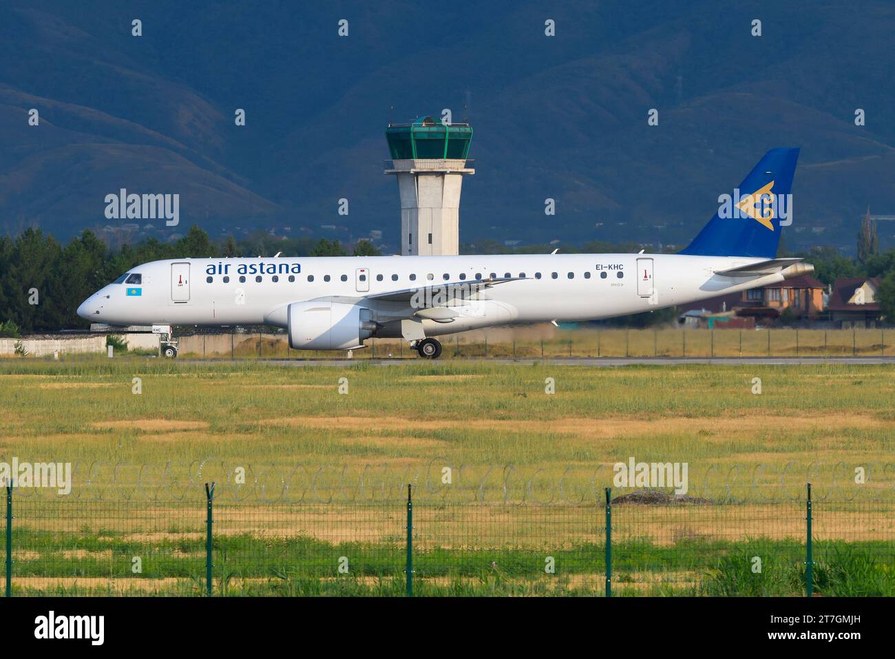Aircraft of Air Astana Embraer 190 E2 taxiing. New airplane Embraer E190-E2 of Air Astana. Plane of AirAstana Embraer. Stock Photo