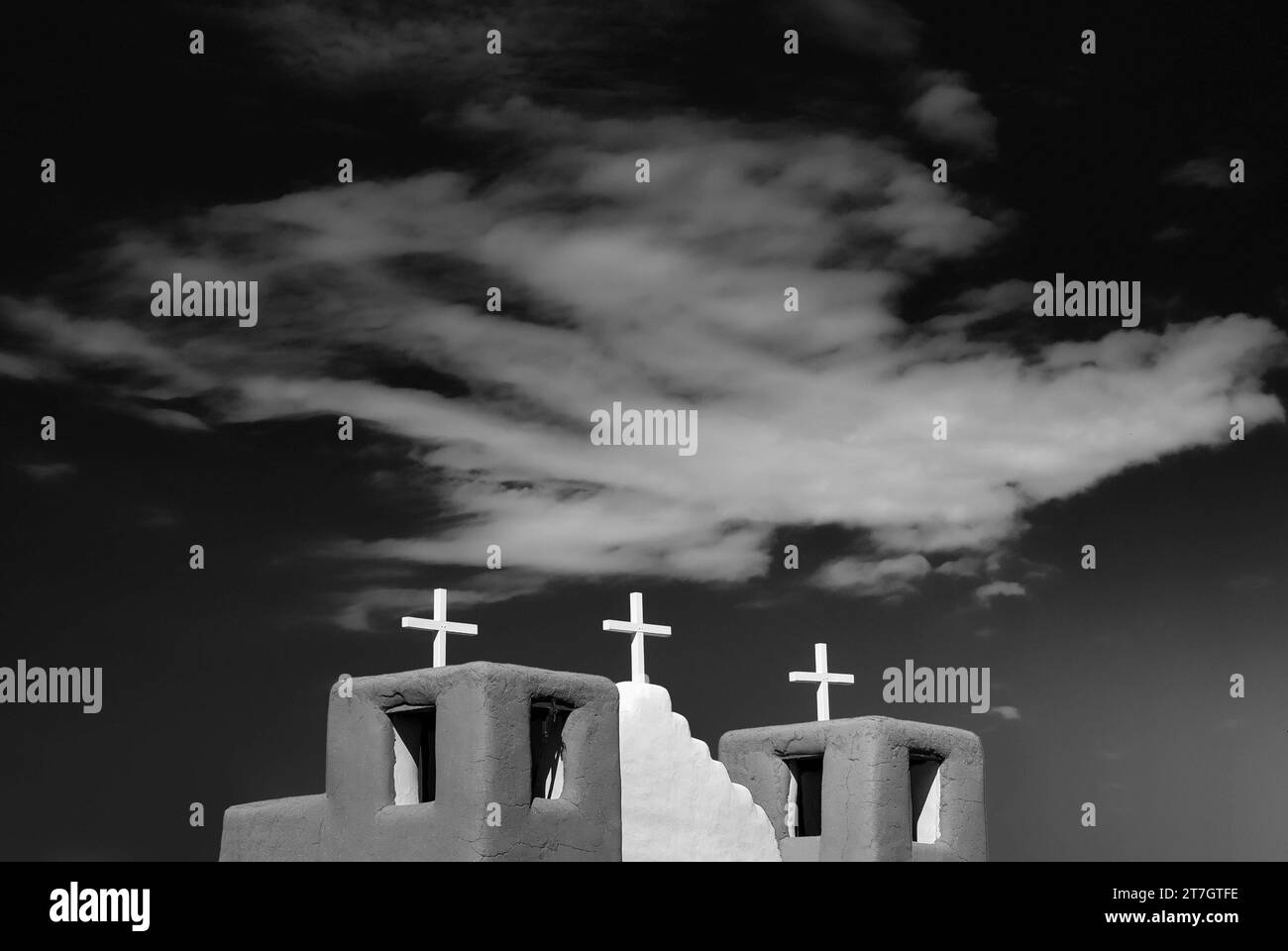 San Geronimo Chapel, cross, church, religion, faith, Christianity, adobe style, blue sky, Taos, New Mexico, USA Stock Photo