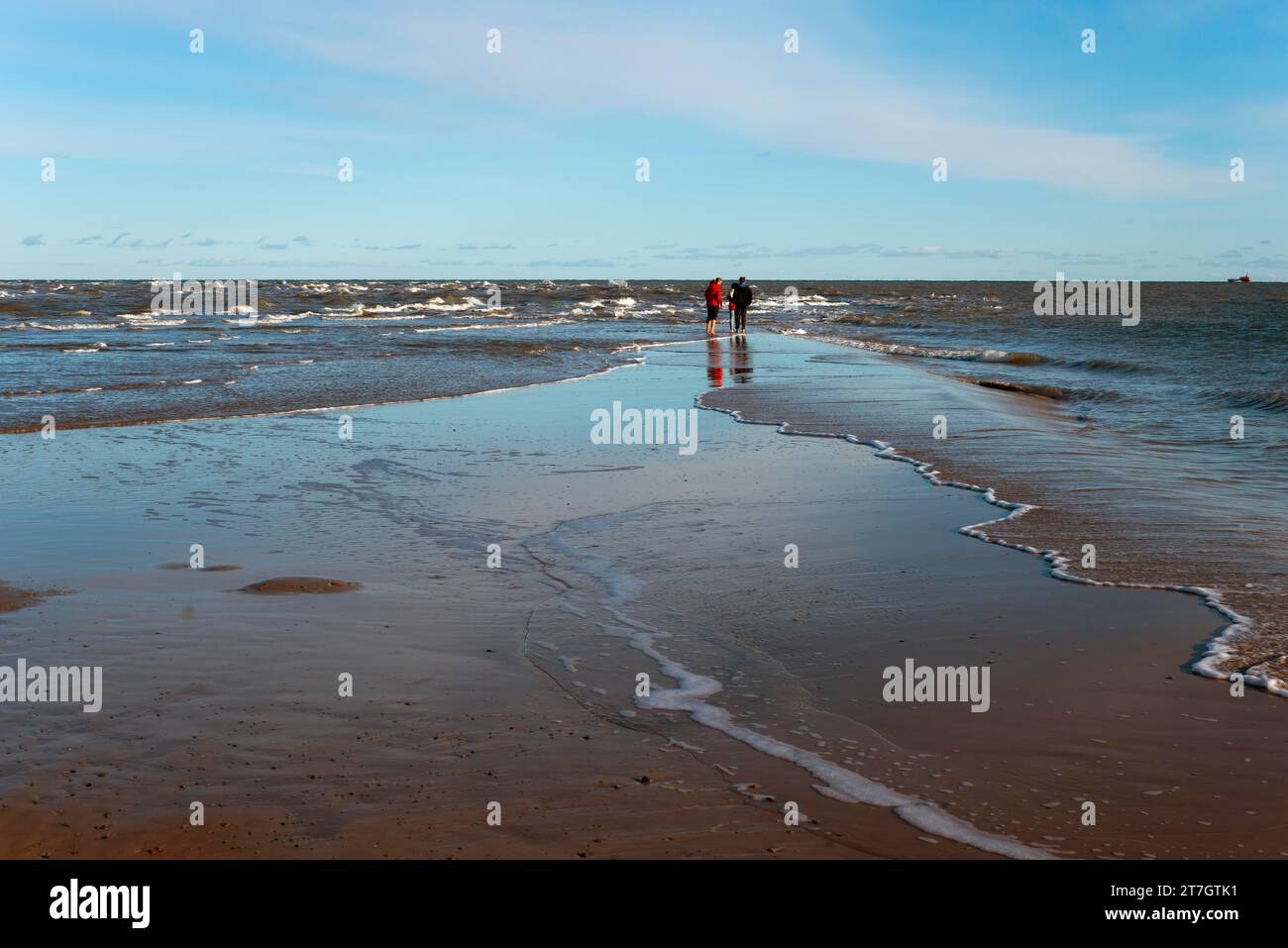 People on headland, Meeting of North Sea and Baltic Sea, Skagerrak and Kattegat, Grenen, Skagens Gren, Skagen, North Jutland, Jutland, Denmark Stock Photo