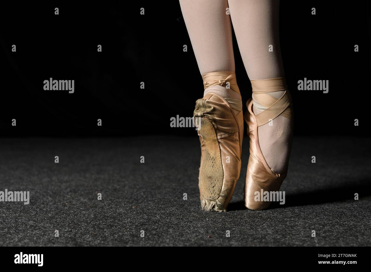 Close up ballerina feet with pointe shoes Stock Photo