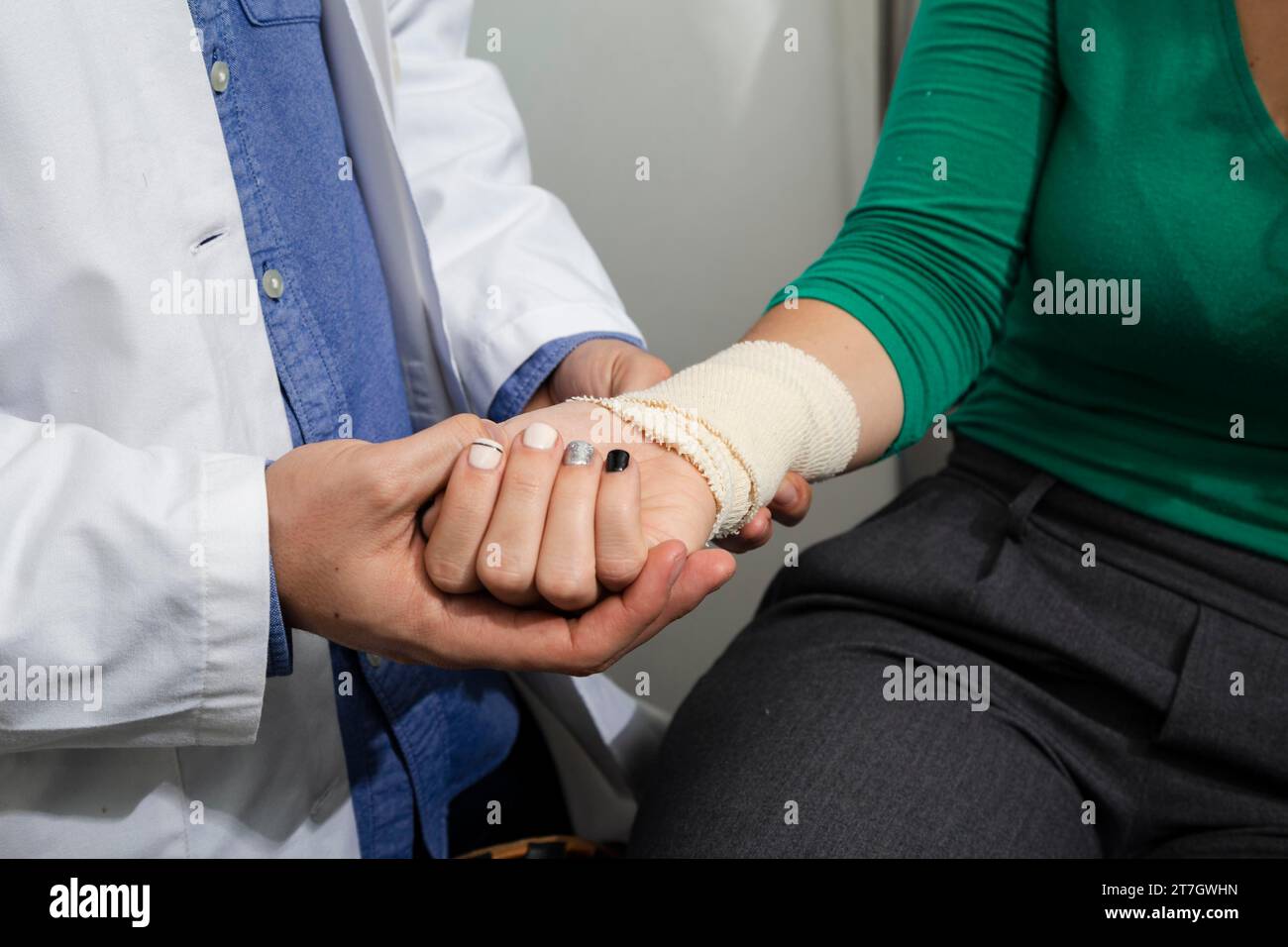 Close up doctor checking bandaged arm Stock Photo Alamy