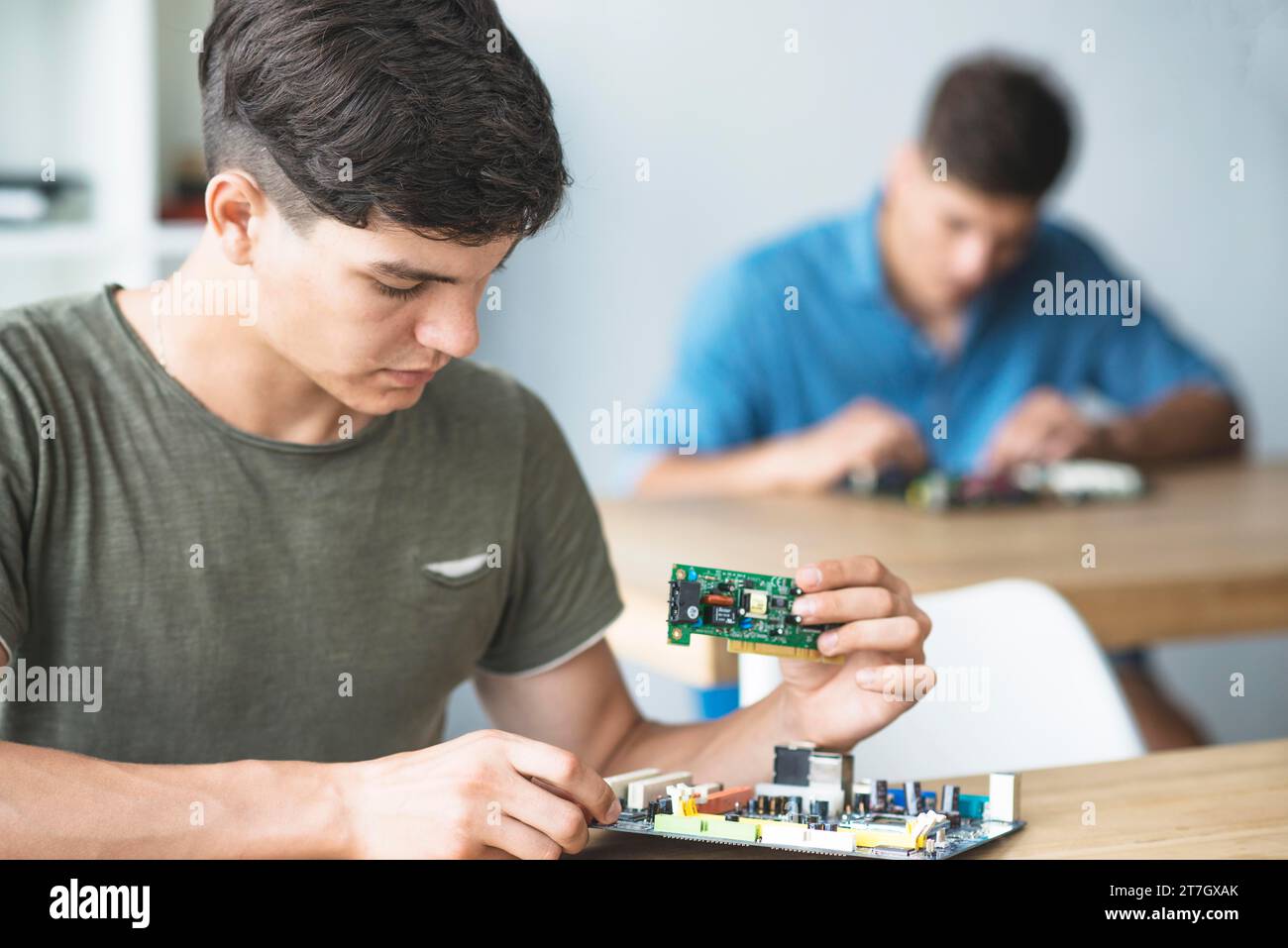 Engineer student learning fix electronic component computer motherboard