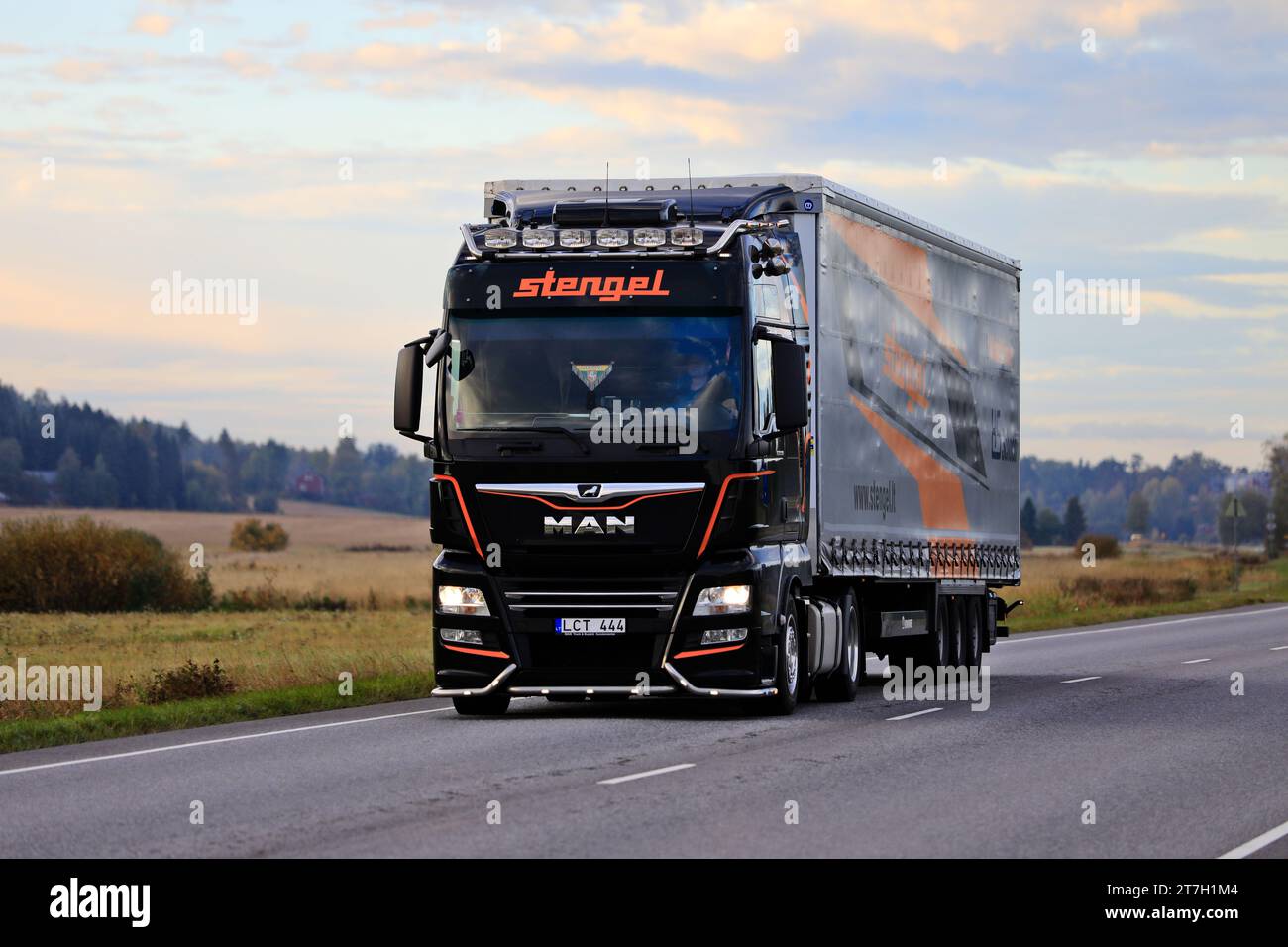 Customised MAN truck semi trailer of Stengel LT hauls goods along highway in South of Finland  early in autumn morning. Salo, Finland. Sept 23, 2022 Stock Photo