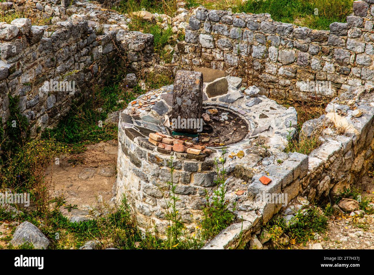 Ancient millstone, ruined city of Stari Bar, originally from the 11th century, is one of the most culturally and historically valuable sites in Stock Photo