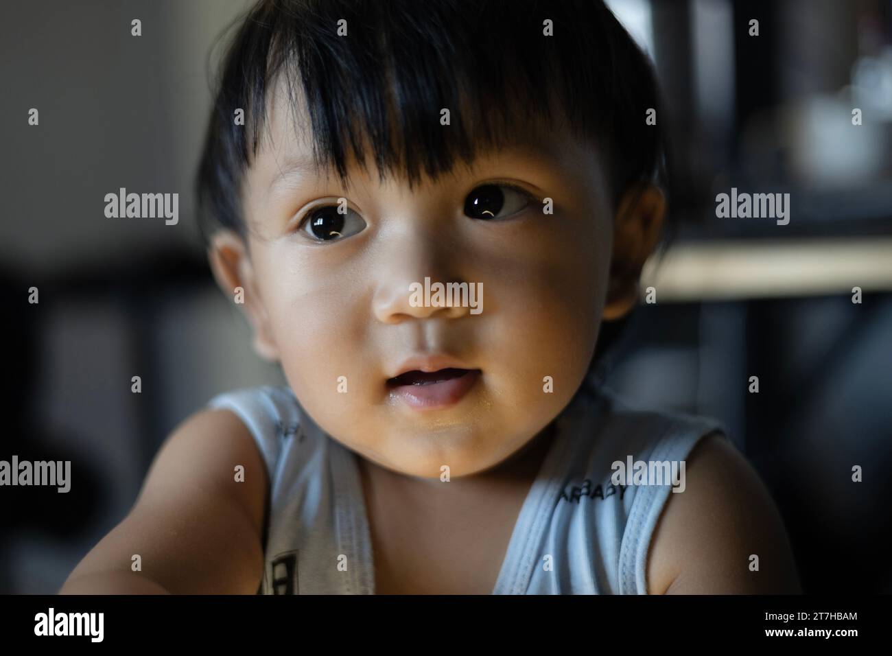 Little Boy Looking Up And Thinking. Close Up Portrait Of Child. Child With Thinking Casually. Stock Photo