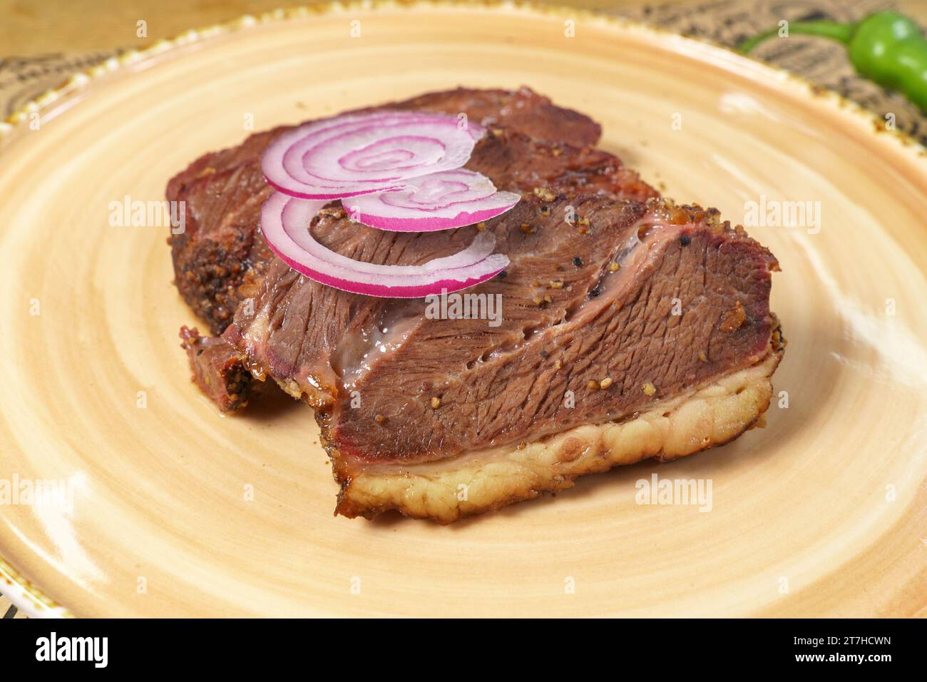 Beef steak close-up with onions. Concept of tasty food. Serving dishes in the restaurant Stock Photo