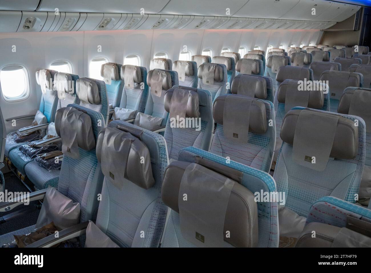 Interior cabin of an Emirates Airline, with ranges of seats Stock Photo ...