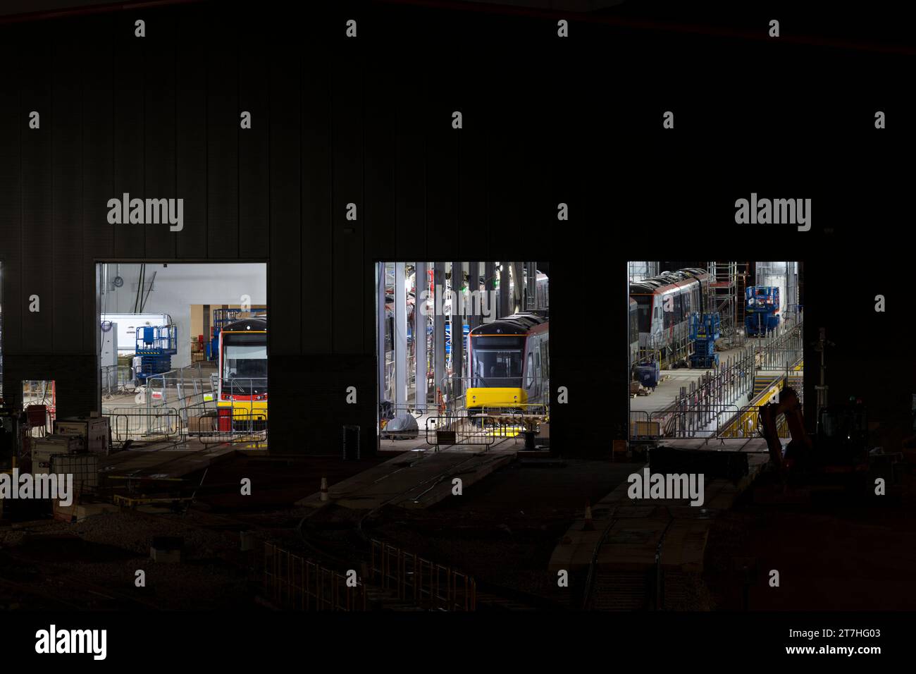 Taff’s Well depot, South Wales, UK  New tram train depot under construction for the south Wales Metro with new Stadler tram trains inside at night. Stock Photo