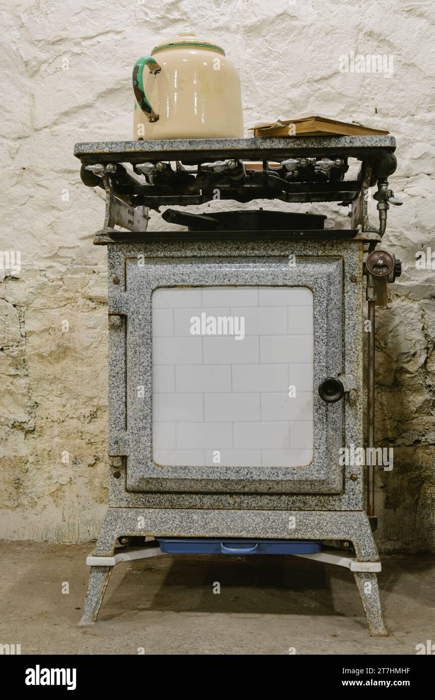 Cast iron gas cooker from c19001920 with enameled kettle on hob Stock Photo Alamy