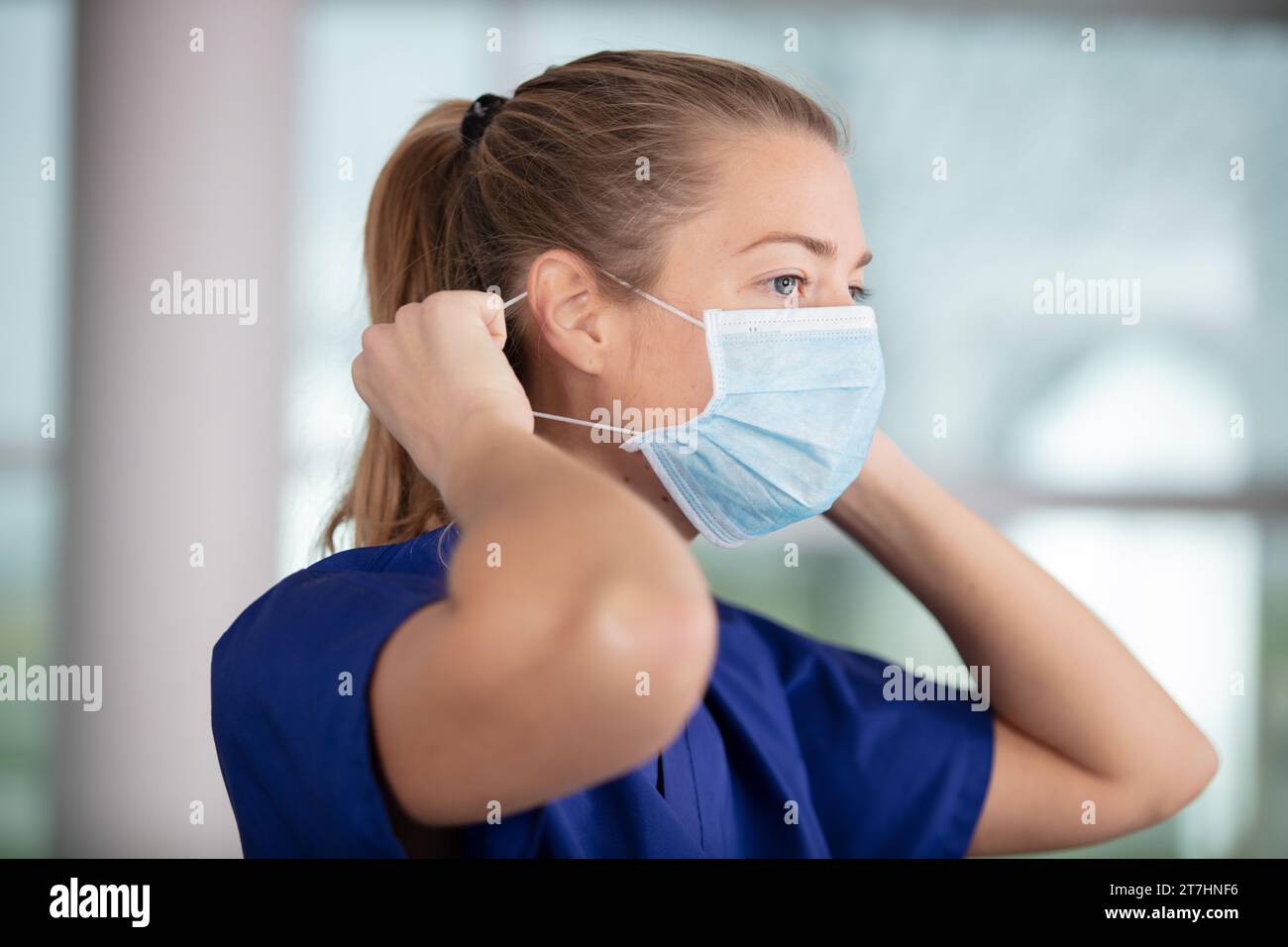 Professional puts face mask woman hi-res stock photography and images ...