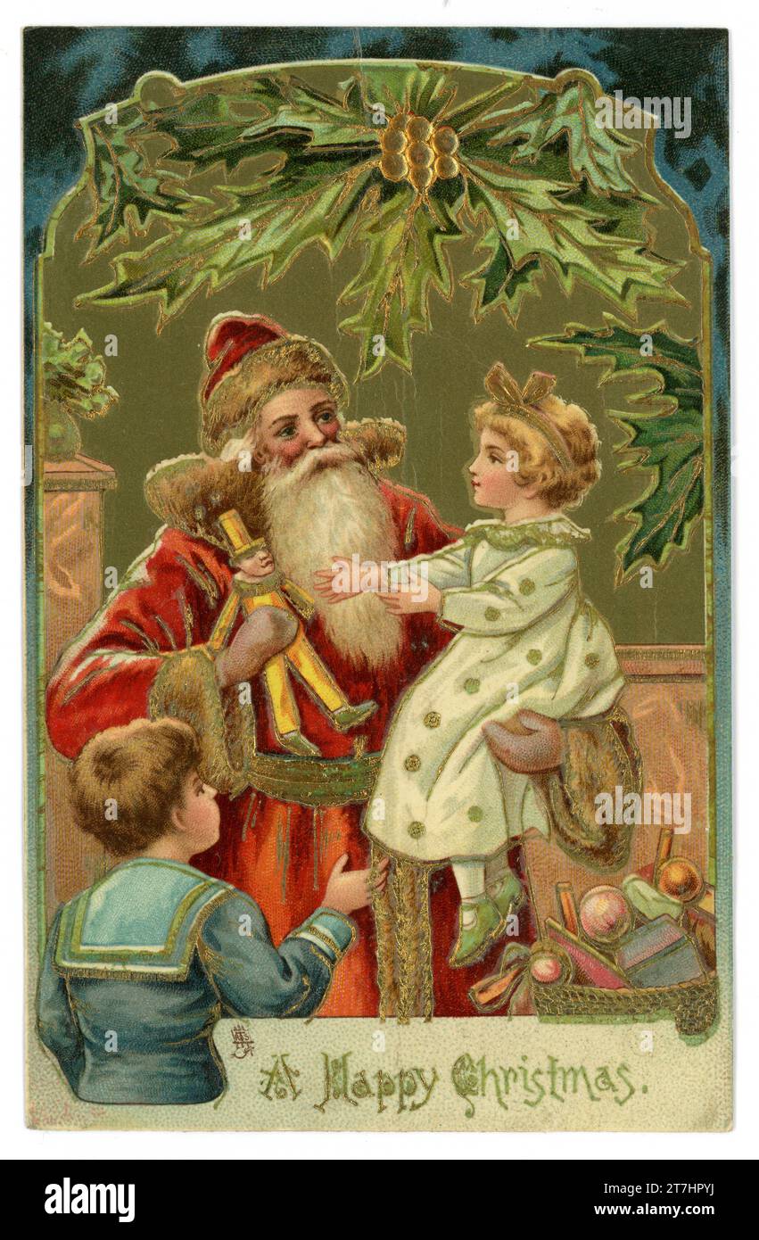 Original charming Edwardian era embossed Christmas card of santa with children receiving presents sitting on his knee. Tuck's Christmas series 1004. Circa 1905, U.K. Stock Photo