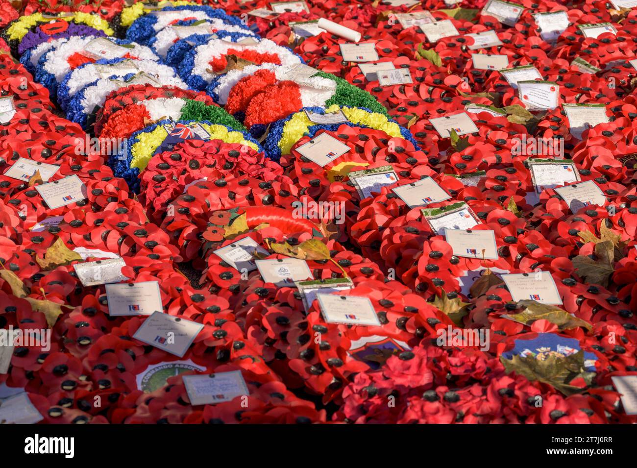 London, UK. Poppy wreaths left at the Cenotaph in Whitehall after the Rememberance Sunday ceremony, November 2023 Stock Photo