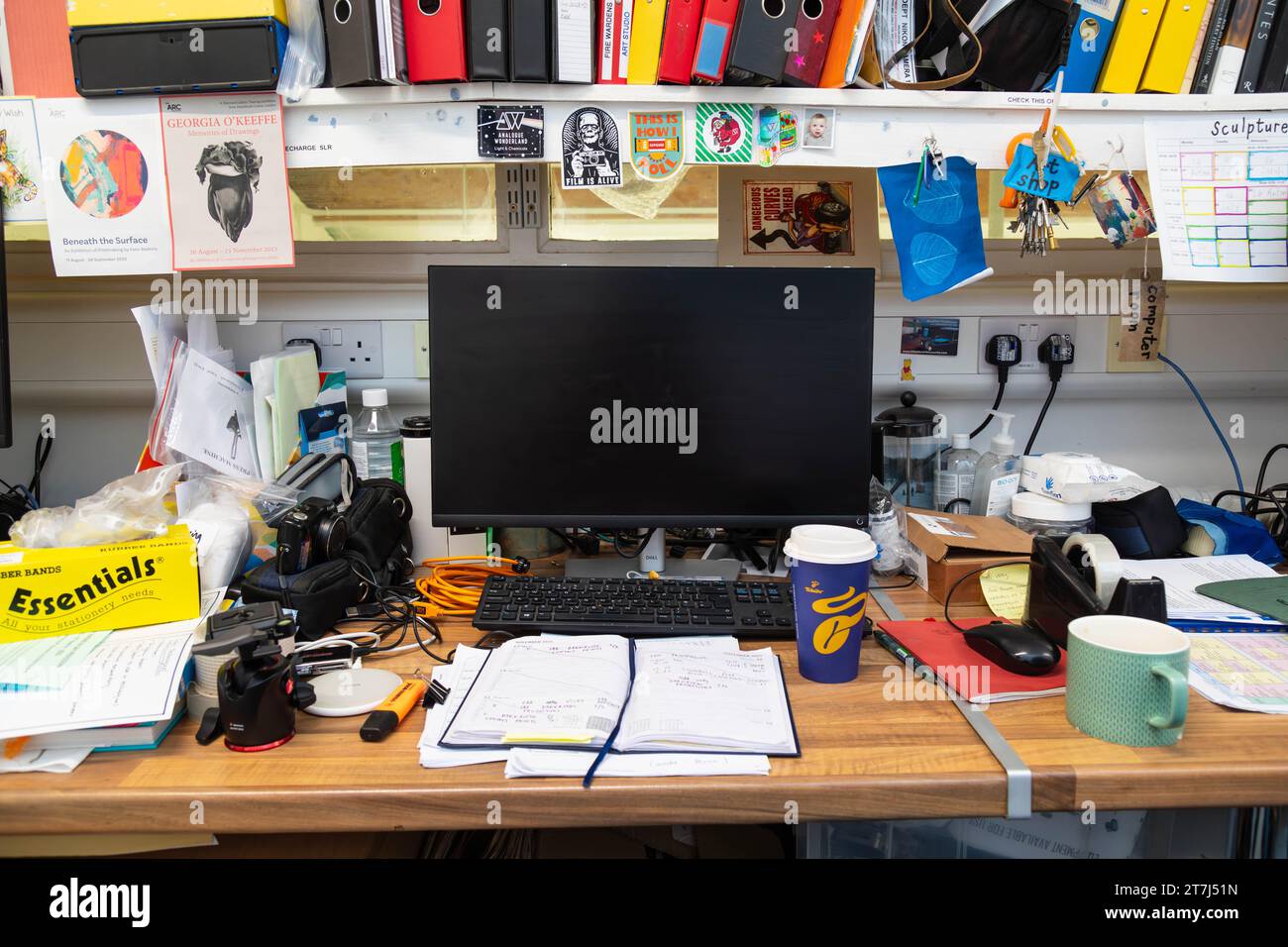 Messy cluttered work office desk, Winchester, Hampshire, England, United Kingdom. Stock Photo