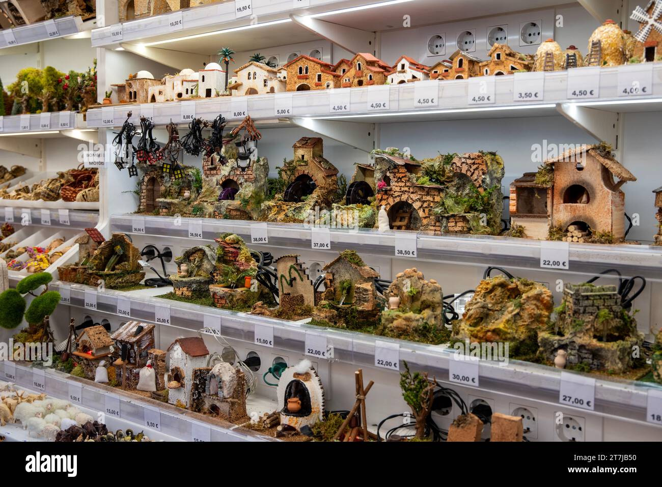 Santa Llucia Market's artisanal magic: A stall dedicated to exquisite handcrafted nativity scenes, adding a touch of tradition and charm to Barcelona' Stock Photo