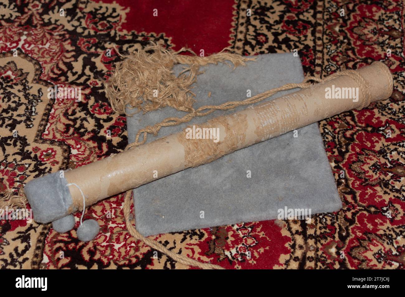 Cat Scratching Posts Repair. An old cat scratching post with torn jute