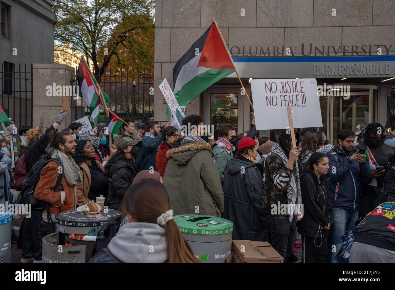 Manhattan United States. 15th Nov 2023. Protesters walk past the Columbia University Bookstore Alfred Lerner Hall with a placard reading No Justice No Peace during the demonstration. Columbia Universi...