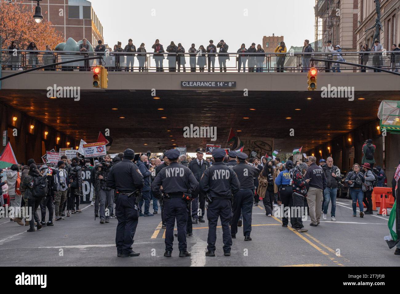 Manhattan, United States. 15th Nov, 2023. NYPD officers look up at ...