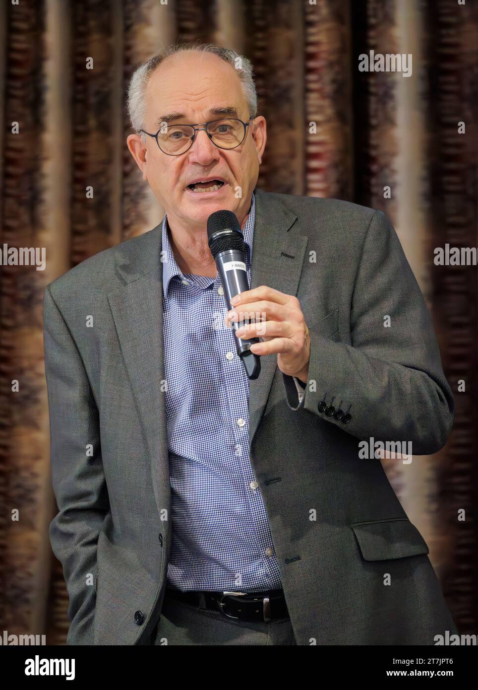 Clive Ruggles, whose daughter, Alice Ruggles was murdered by an ex-boyfriend in Gateshead in 2016 following a relentless campaign of stalking, speaks during the Department of Justice Stalking Awareness event, at the Newforge Country Club, Belfast. The event coincides with the full implementation of the Protection from Stalking Act (NI) 2002 and will enhance awareness of the availability of the new Stalking Protection Orders, and improve understanding of stalking and the type of behaviours that go with it. Picture date: Thursday November 16, 2023. Stock Photo