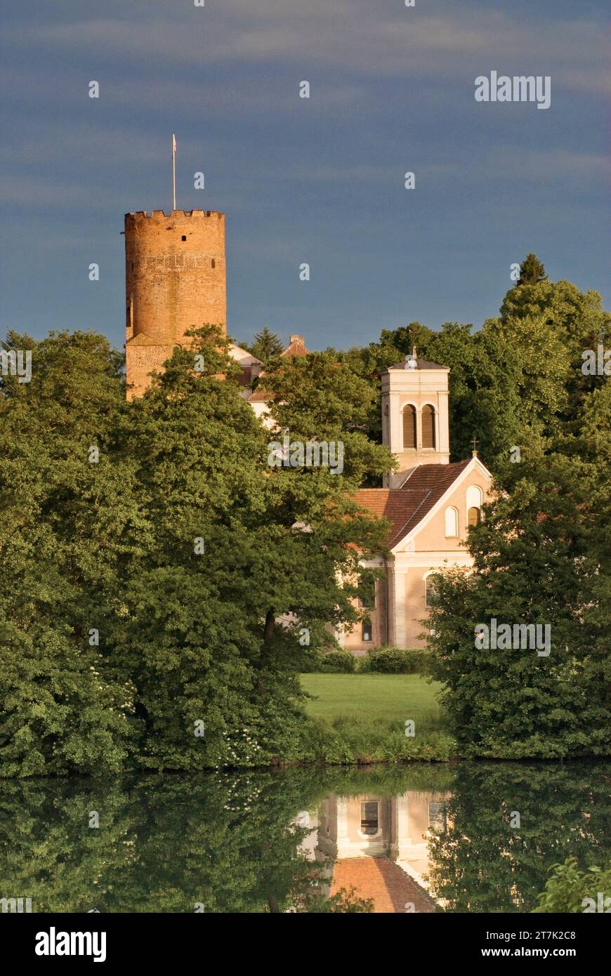 Tower at Castle of Knights of St John of Jerusalem and church over Ciecz Lake in Łagów, Lubuskie Voivodeship,  Poland Stock Photo