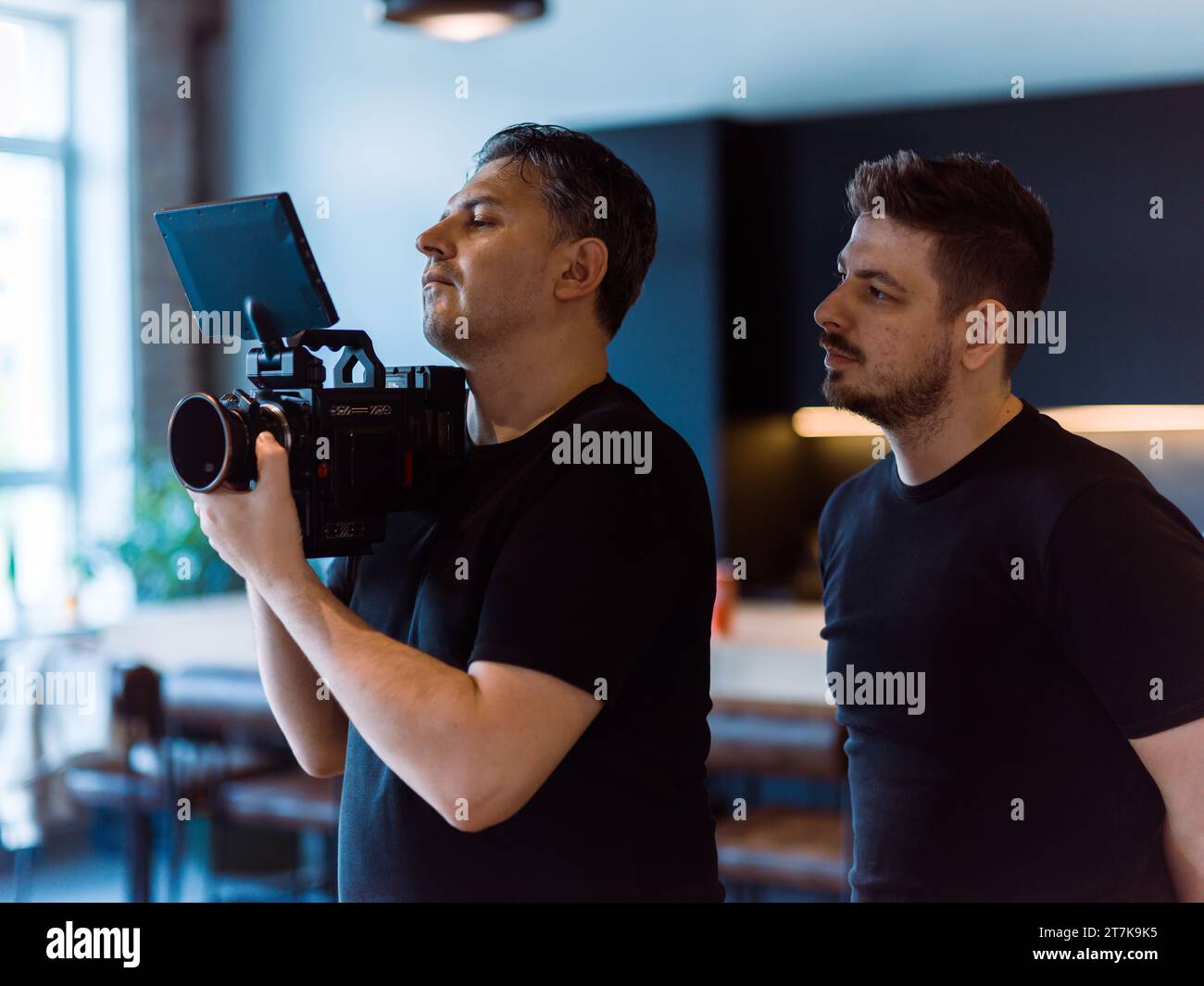 Directing In Camera Director of photography with a camera in his hands on the set ...