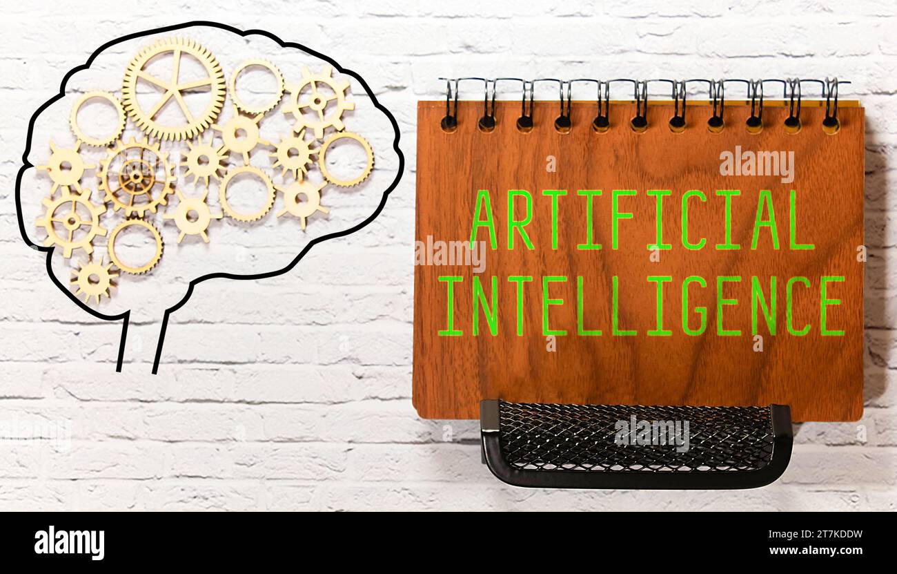AI text with a person holding a pen on a wooden desk. Stock Photo