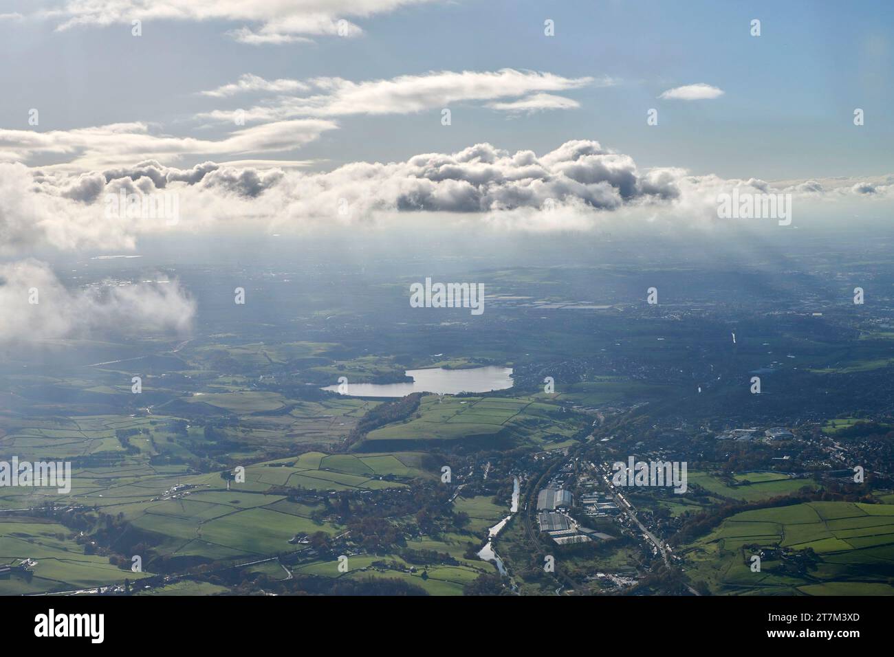 An ethereal aerial photograph looking west over the Pennines towards Rochdale and showing Hollingworth lake under the clouds, north west England, UK Stock Photo