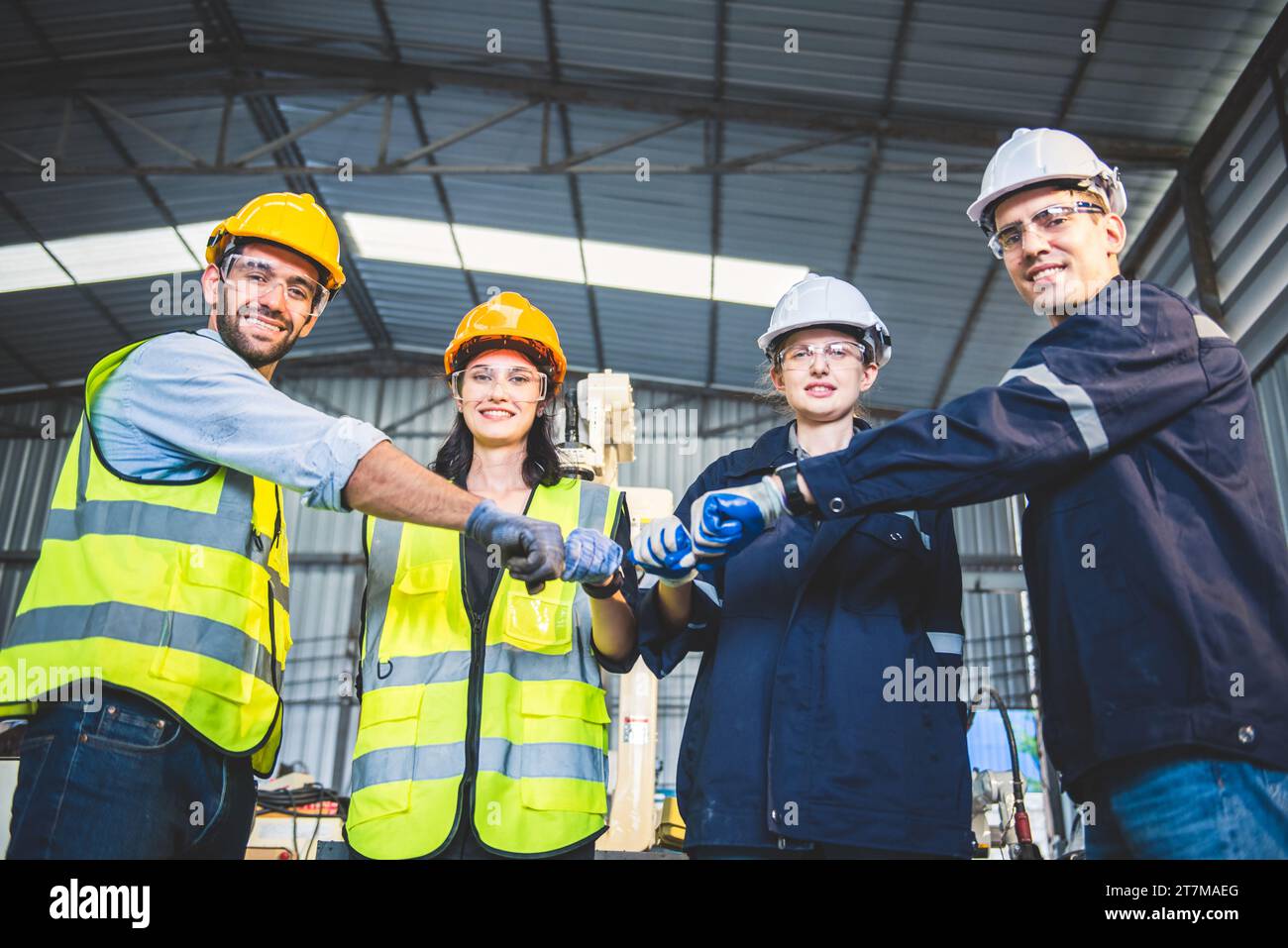 Engineers team mechanic standing in steel factory workshop industry
