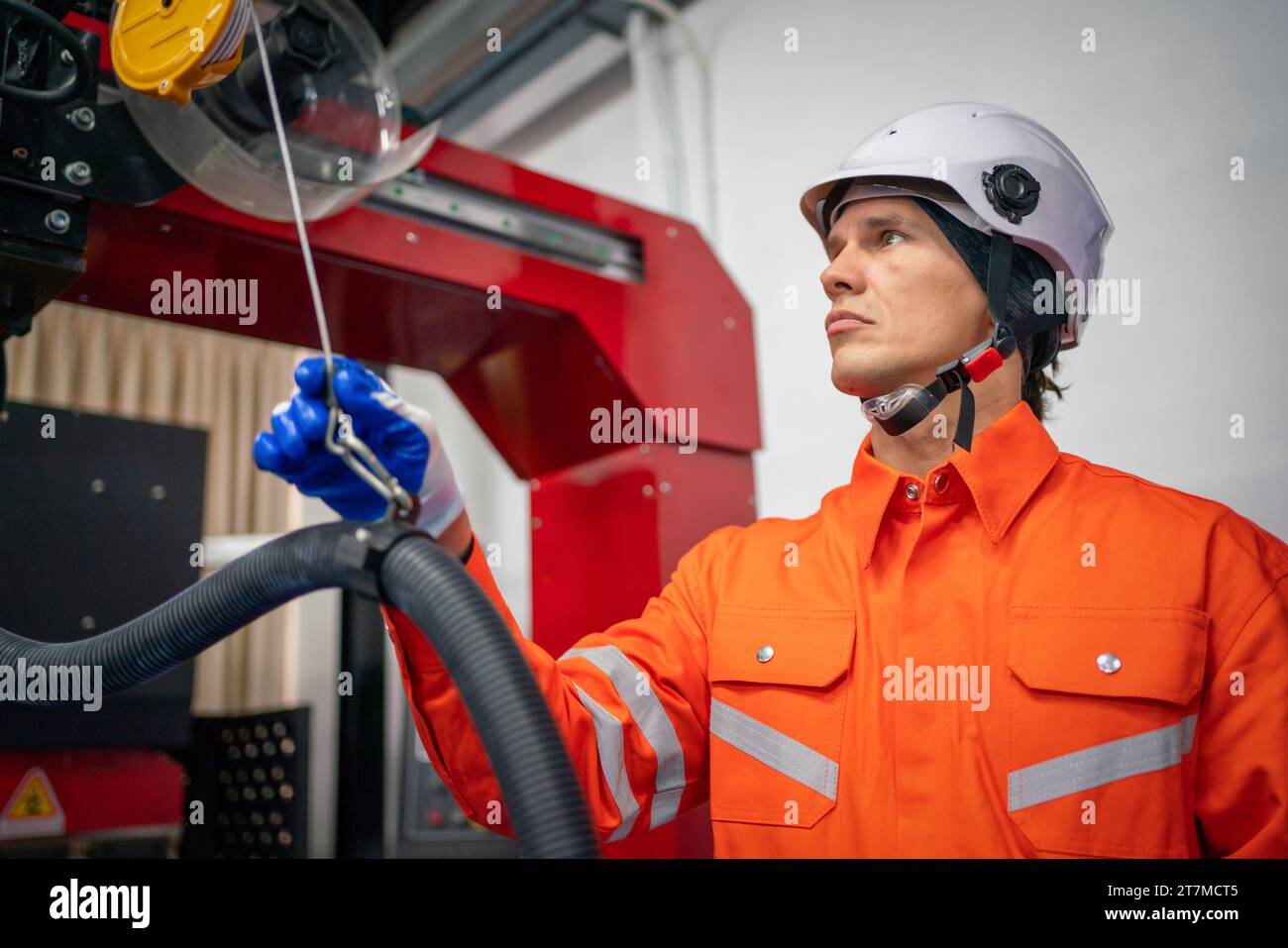 Engineers mechanic using computer controller Robotic arm for welding steel in steel factory