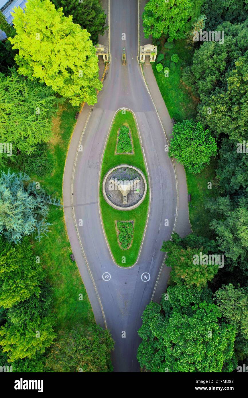 An aerial view of a scenic rural landscape featuring a road winding ...