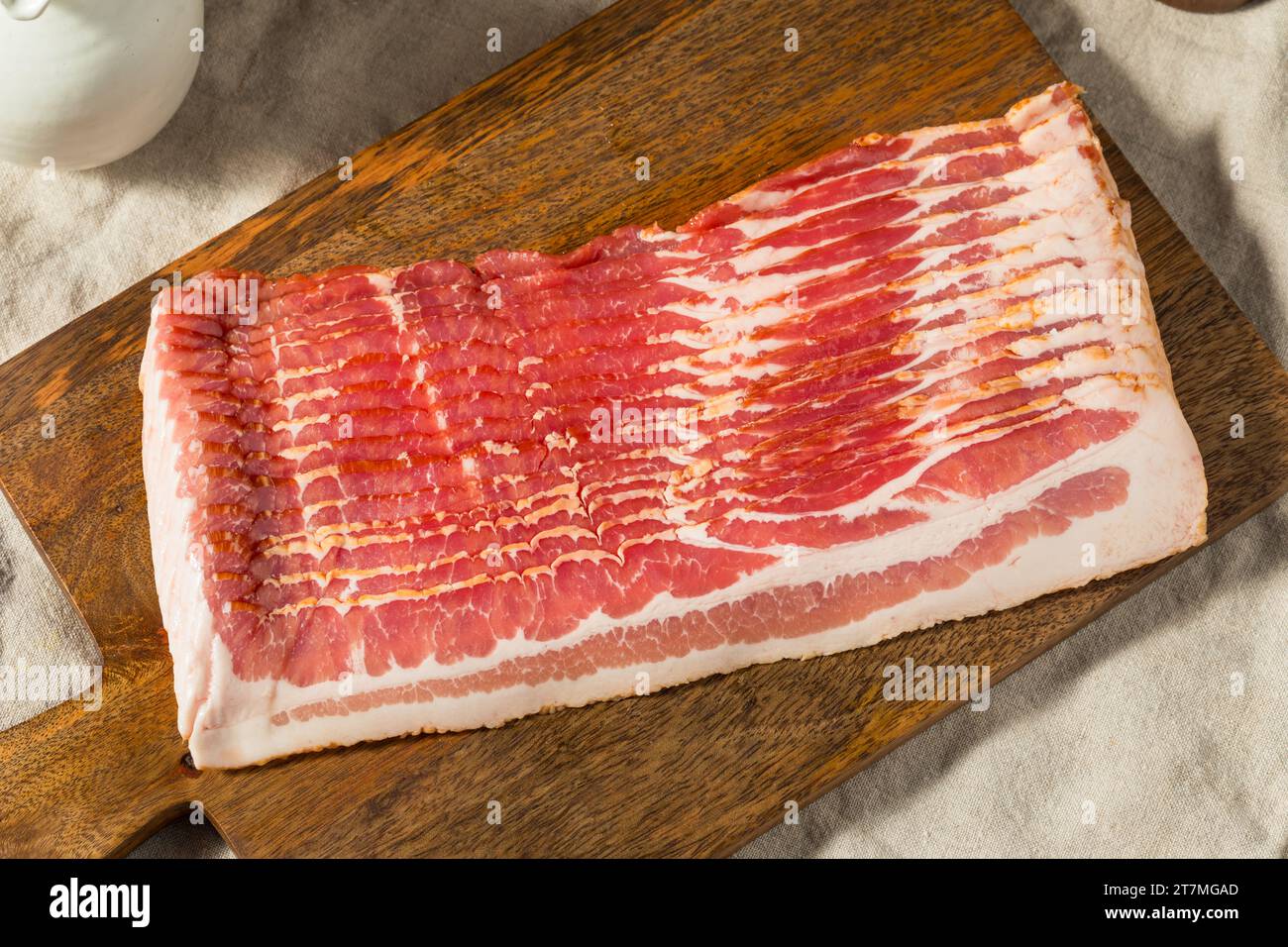 https://c8.alamy.com/comp/2T7MGAD/red-organic-raw-bacon-cut-into-slices-2T7MGAD.jpg