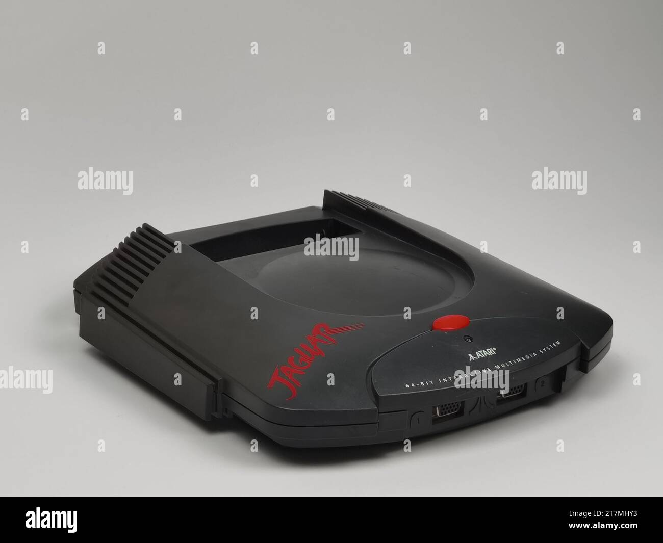 The Atari Jaguar retro gaming system from the side on a white background. Stock Photo