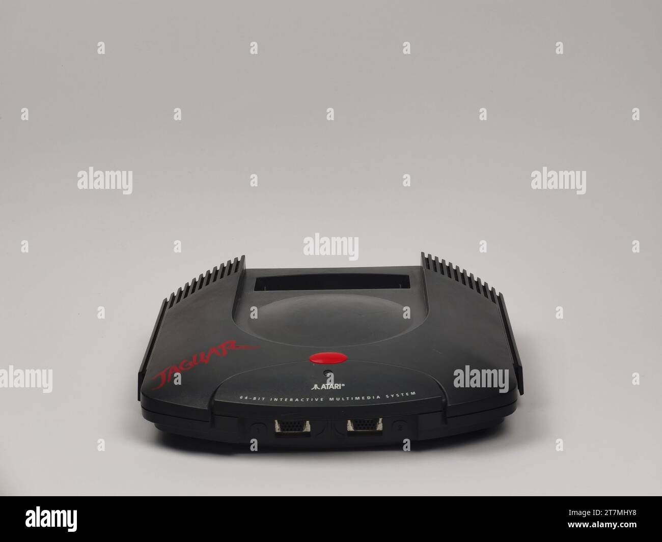 An image of an Atari Jaguar retro gaming system, the front facing the camera, set against a stark white background Stock Photo