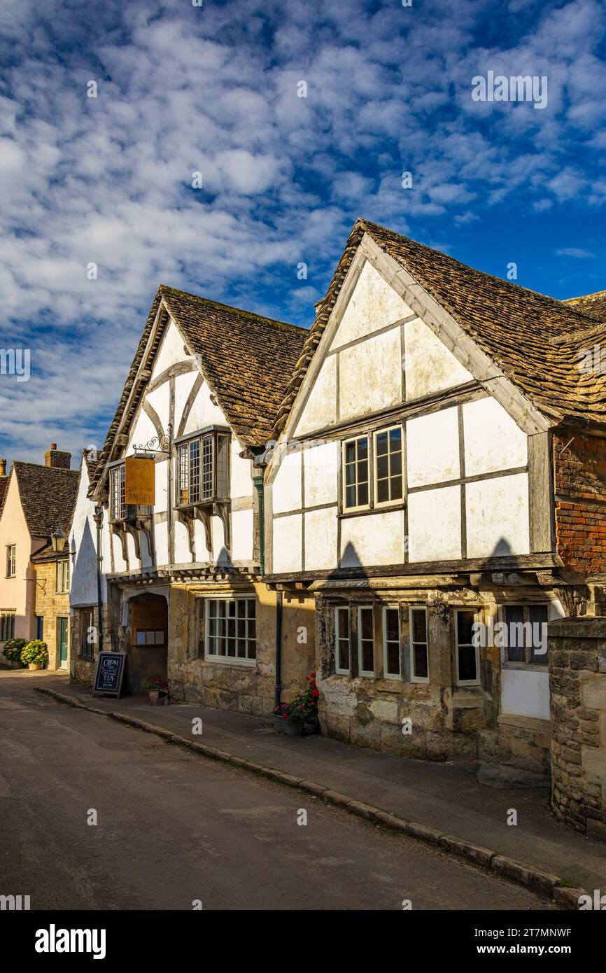 The historic Sign of the Angel hotel on Church Street is a popular tourist attraction in Lacock village, Wiltshire, England, UK Stock Photo