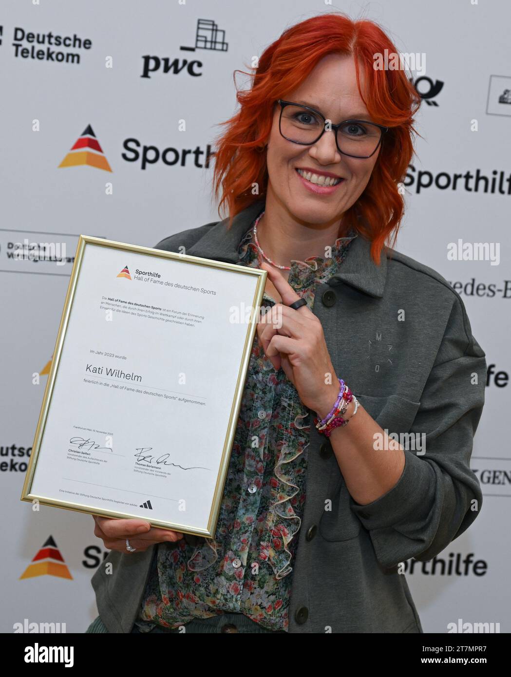 Neu Isenburg, Germany. 16th Nov, 2023. Kati Wilhelm, Olympic biathlon champion, holds her certificate for induction into the 'Hall of Fame of German Sport' during a press event organized by the German Sports Aid Foundation in Gravenbruch. Credit: Arne Dedert/dpa/Alamy Live News Stock Photo