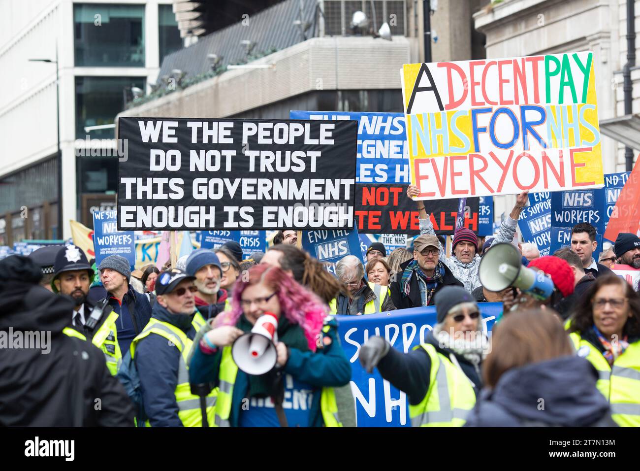 Participants gather and march during the SOS NHS demonstration in London. Stock Photo