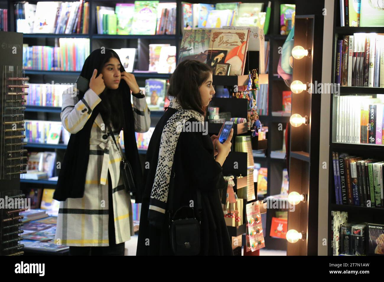Tehran, Iran. 16th Nov, 2023. Customers browse through titles at a bookstore in northern Tehran. Iran has a rich literary tradition with a long history of producing influential works of literature. Bookstores can be found in major cities, offering a range of titles, including classic Persian literature, contemporary Iranian authors, and translated works. (Credit Image: © Rouzbeh Fouladi/ZUMA Press Wire) EDITORIAL USAGE ONLY! Not for Commercial USAGE! Stock Photo