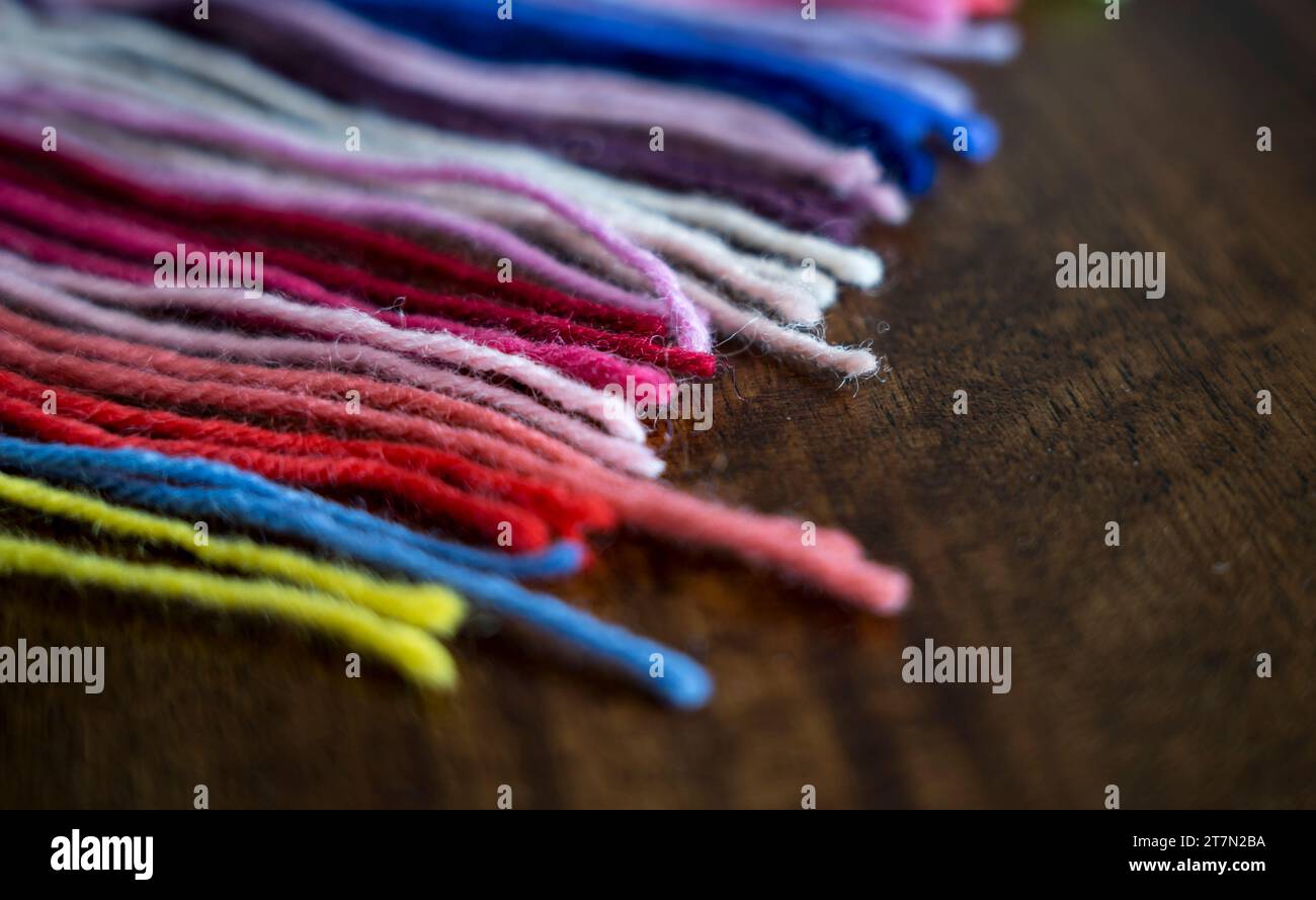 Close up of vibrant created from wool yarn in different colors Stock Photo