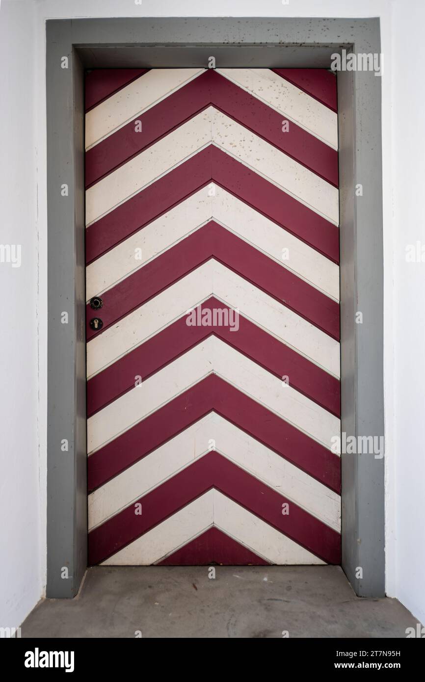 Red and white striped door in a historic building in the Old Town of Wangen im Allgäu, Baden-Württemberg, Germany. Stock Photo
